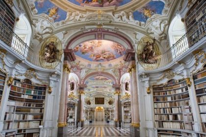 The interior of the magnificent Library of Adammine Monastery with a painted roof and Baroque architecture