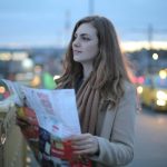 Tourist using paper maps