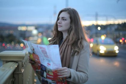 Tourist using paper maps