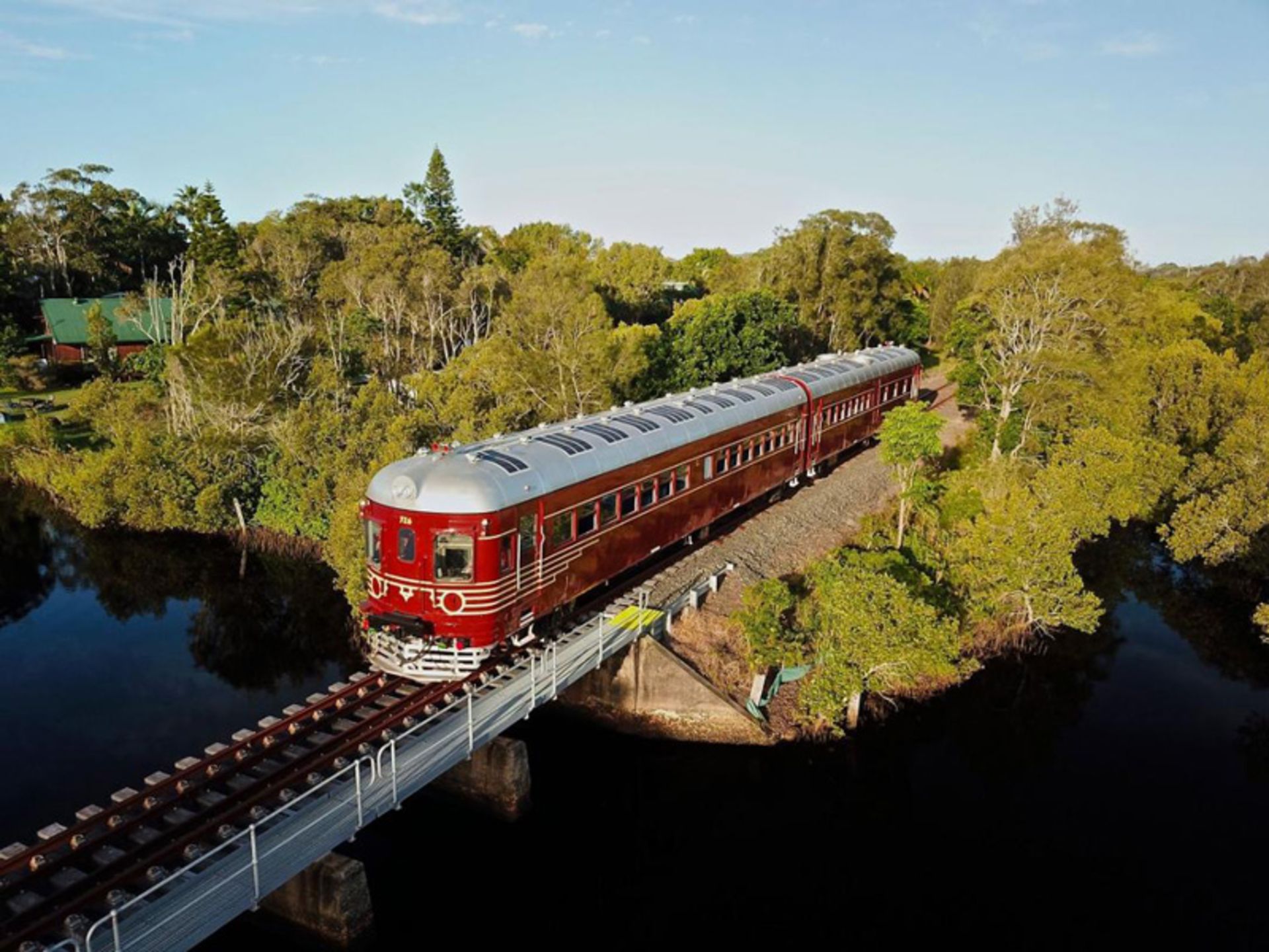 Biron Bay's solar train crossing the rail bridge
