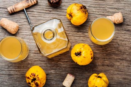 Syrup to lemon with fruit to fresh wooden table