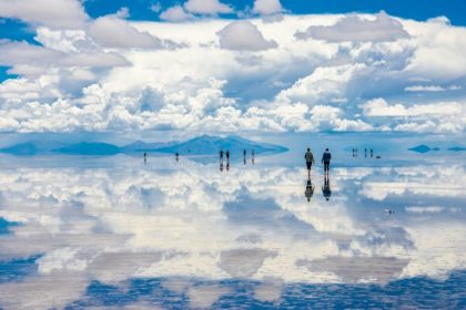 Reflection of blue sky and white clouds in the desert desert