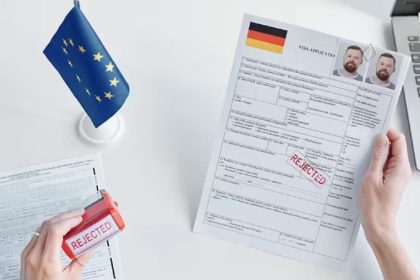 Red Regular stamp on a man's visa