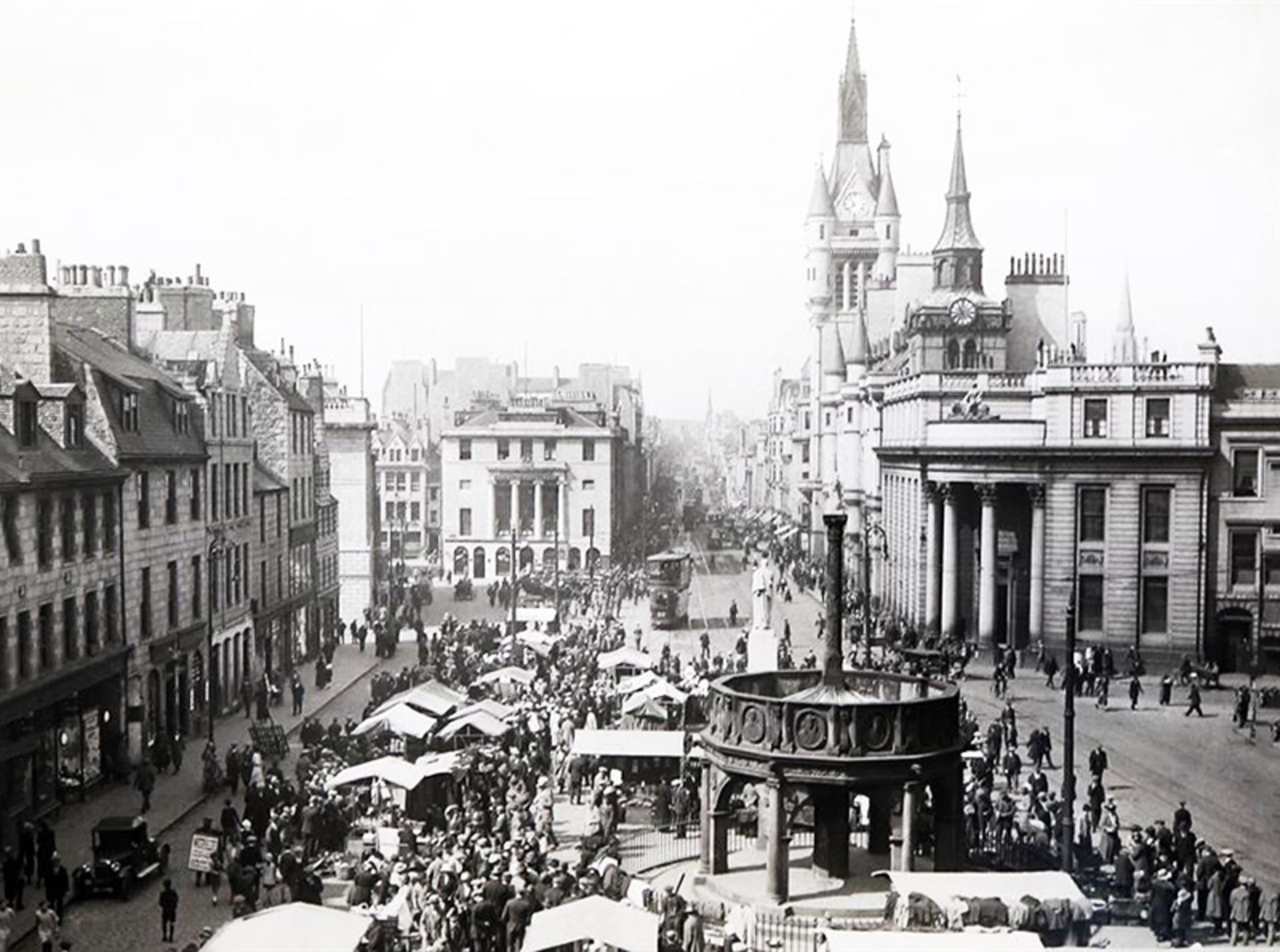 A crowded street with classic structures in Abirdin, Scotland
