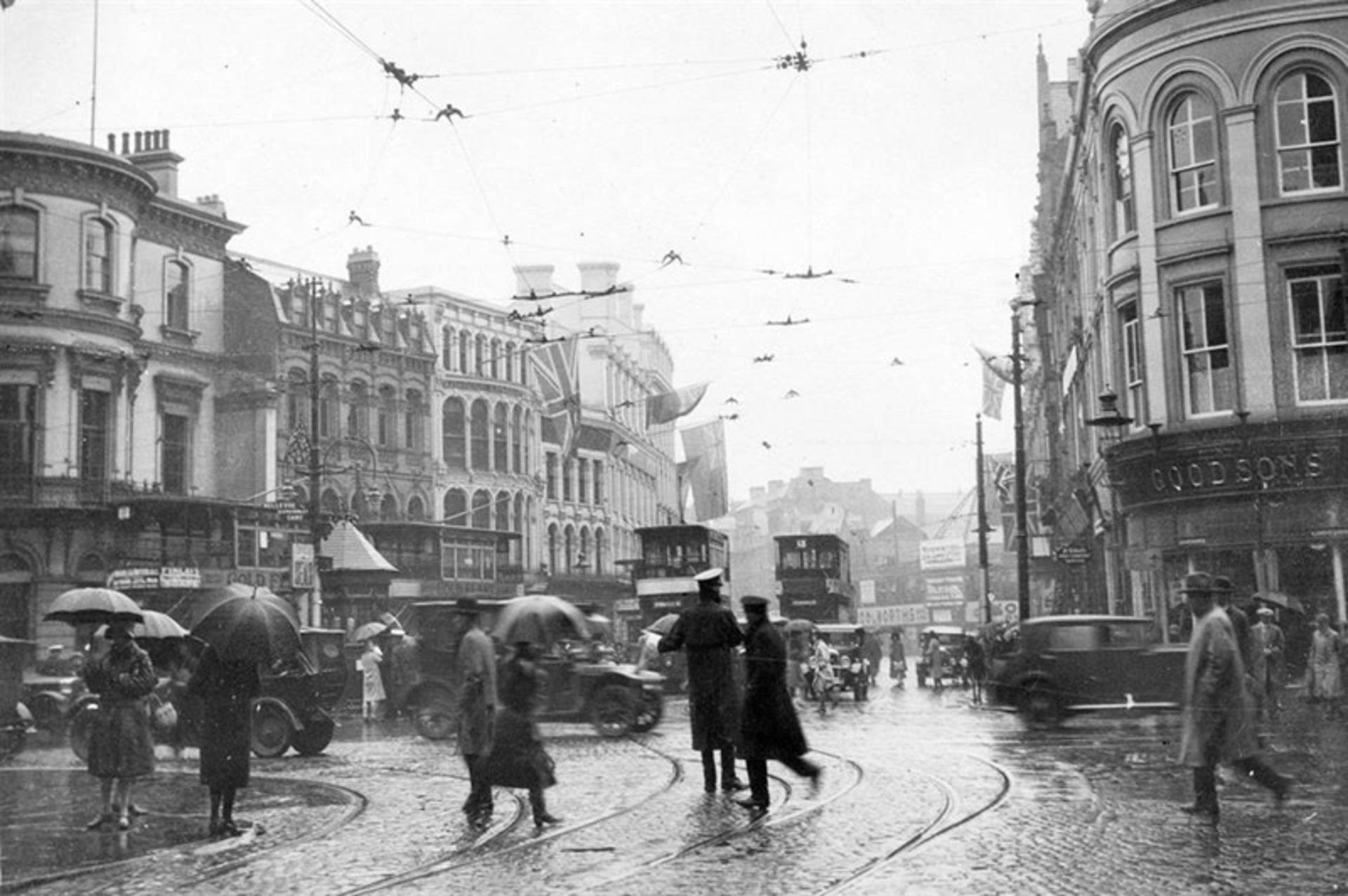The presence of people with umbrella on the street rainy day in Belfast, Northern Ireland