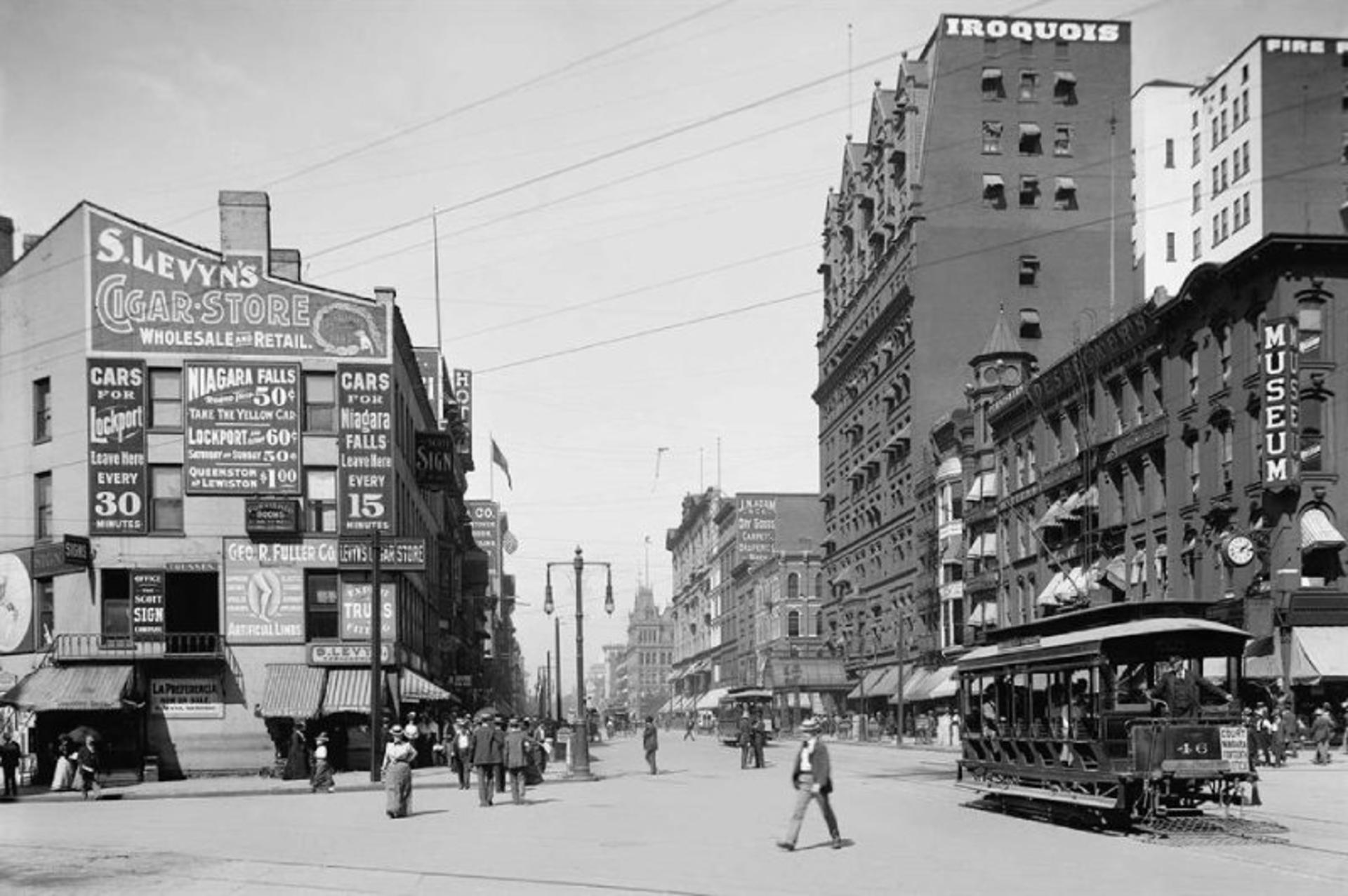 Old image of people and buildings on the main street of Buffalo