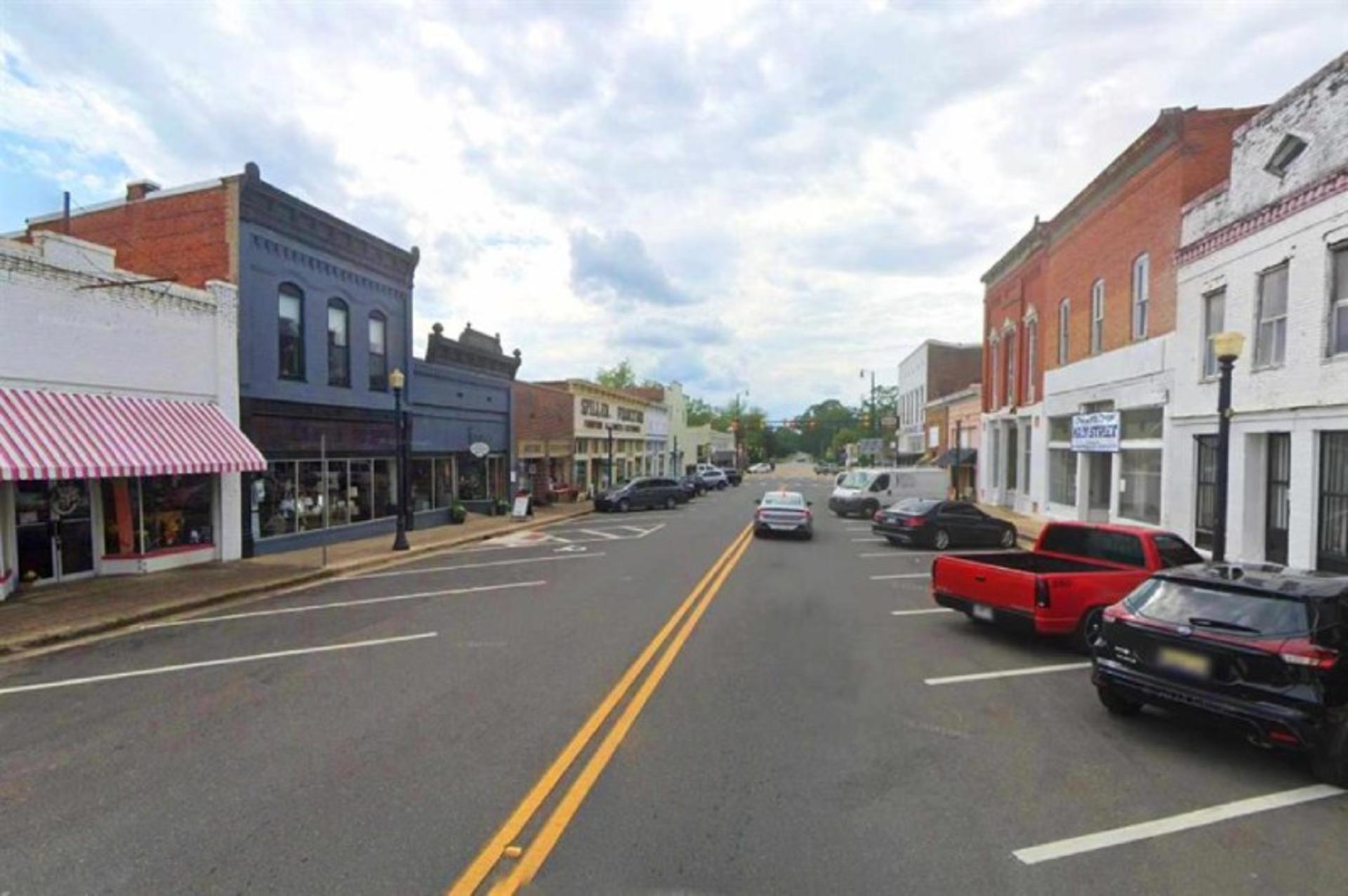 Shops and cars on the main street of Greensburo