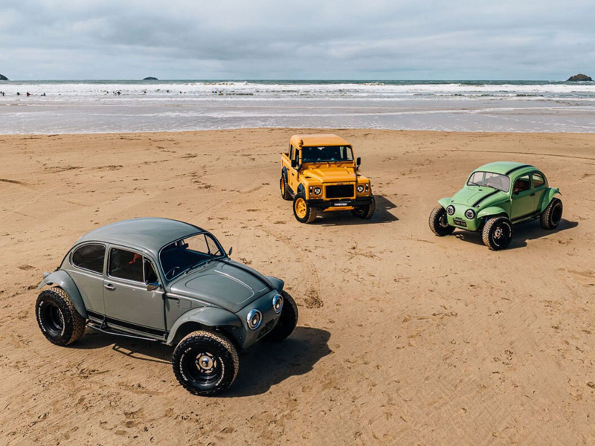 Different Cars of the Company on the Beach