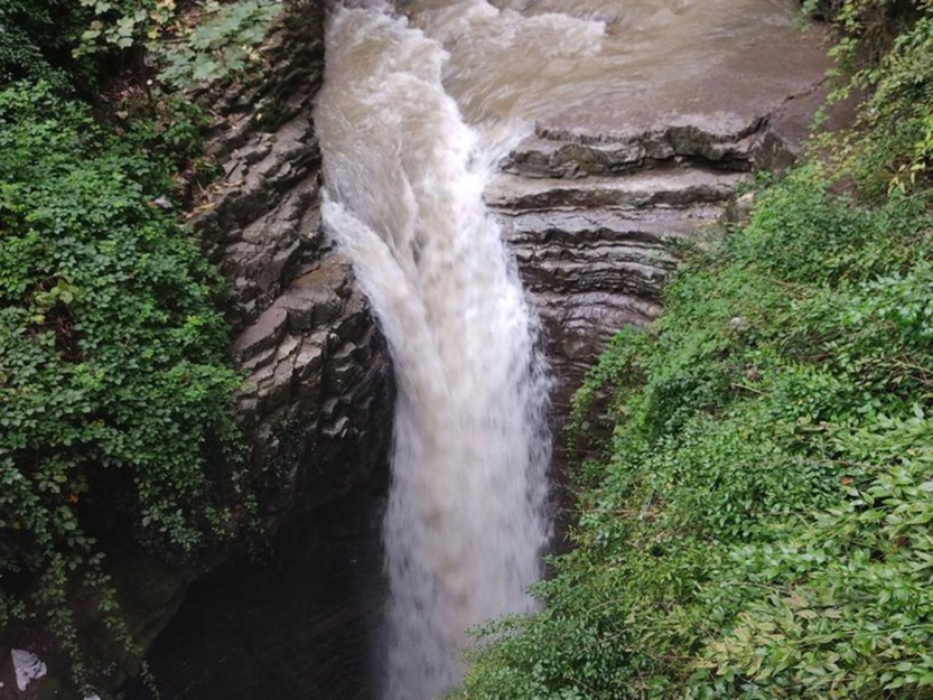 Visadar waterfall among huge rocks and green nature