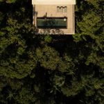 Aerial image of the canopy housing building and the surrounding trees