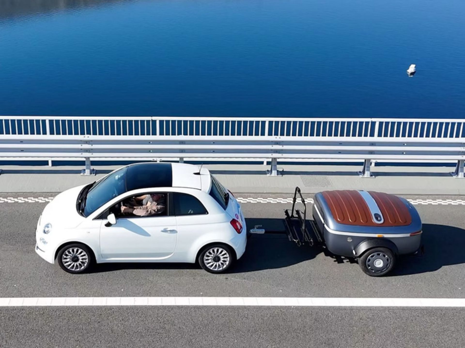 Electric car carrying boba on the road