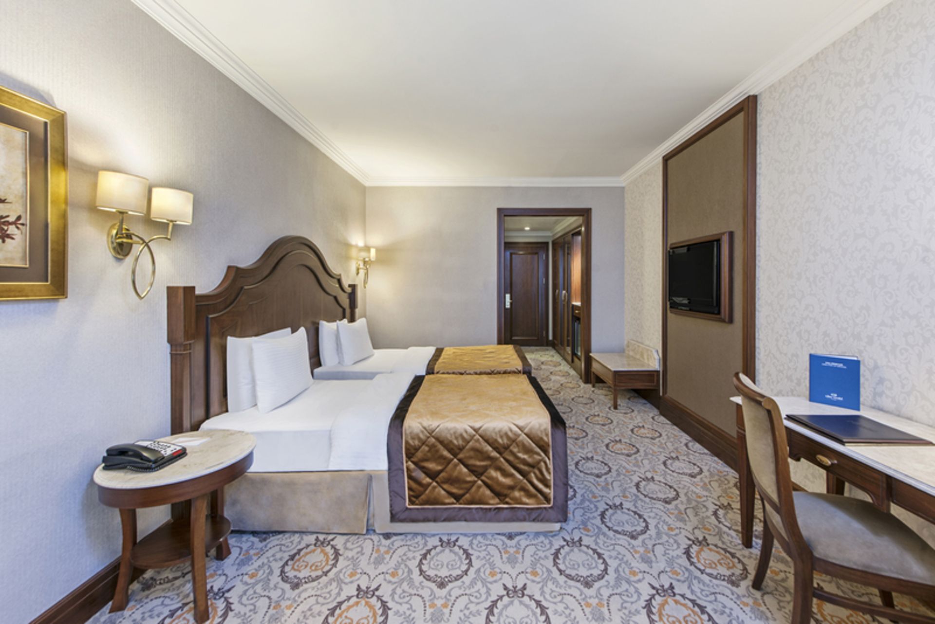 Double room with cream decoration in Elite World One Hotel