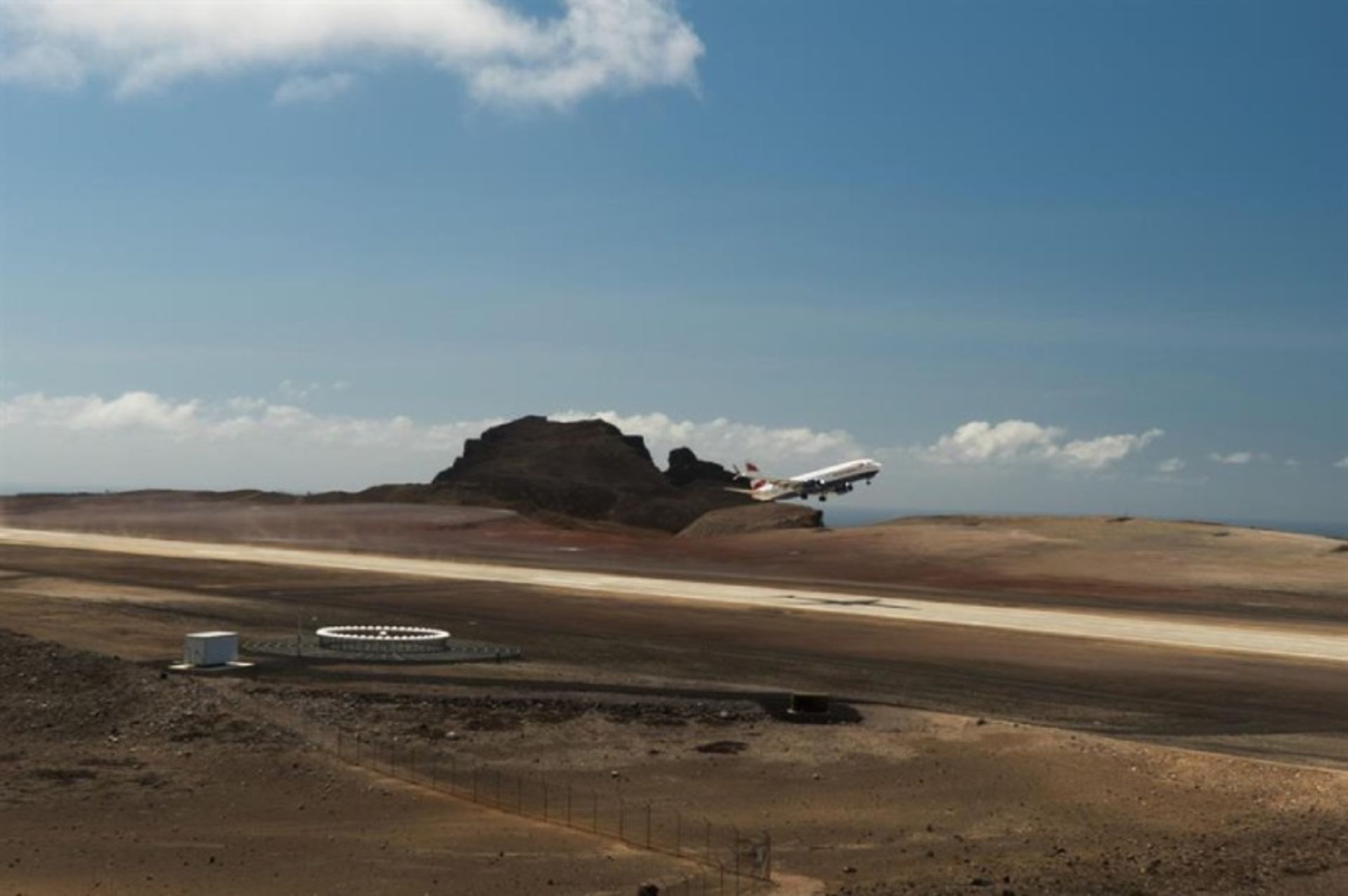 Airplane on the runway of St. Helena airport in the Atlantic Ocean