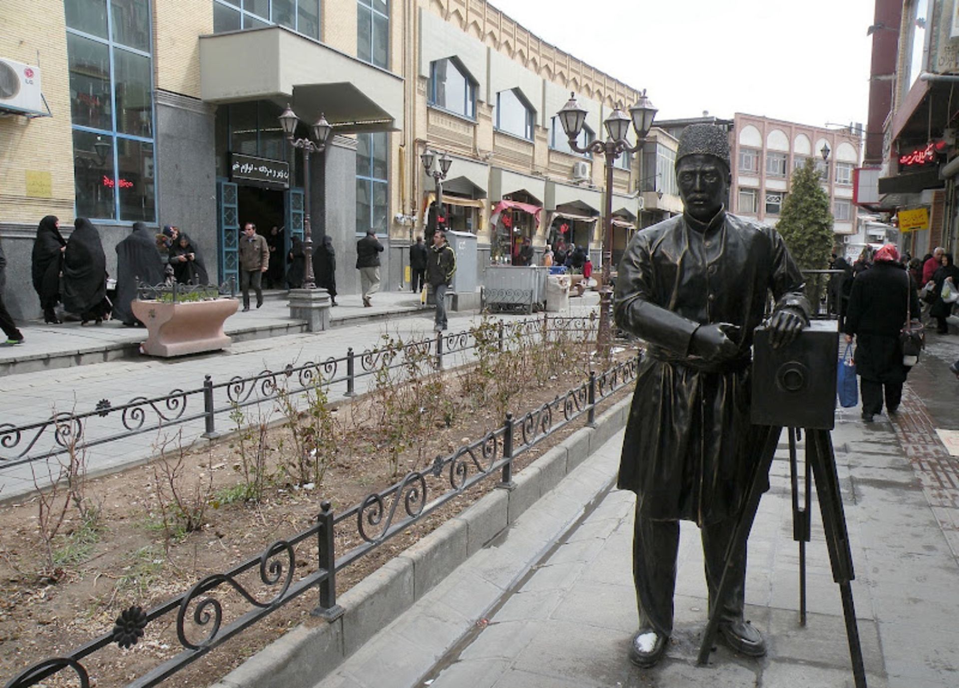 The statue of a photographer in Tarbiat Street