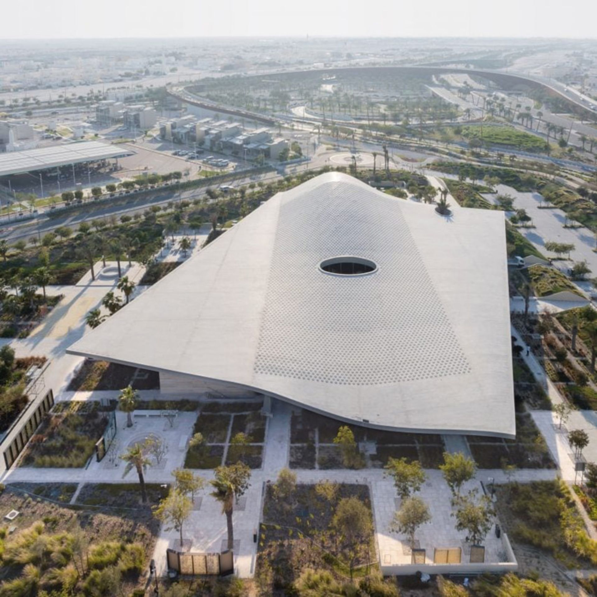Aerial photo of the mesh roof of the center and Al-Mujadalah Mosque in Qatar