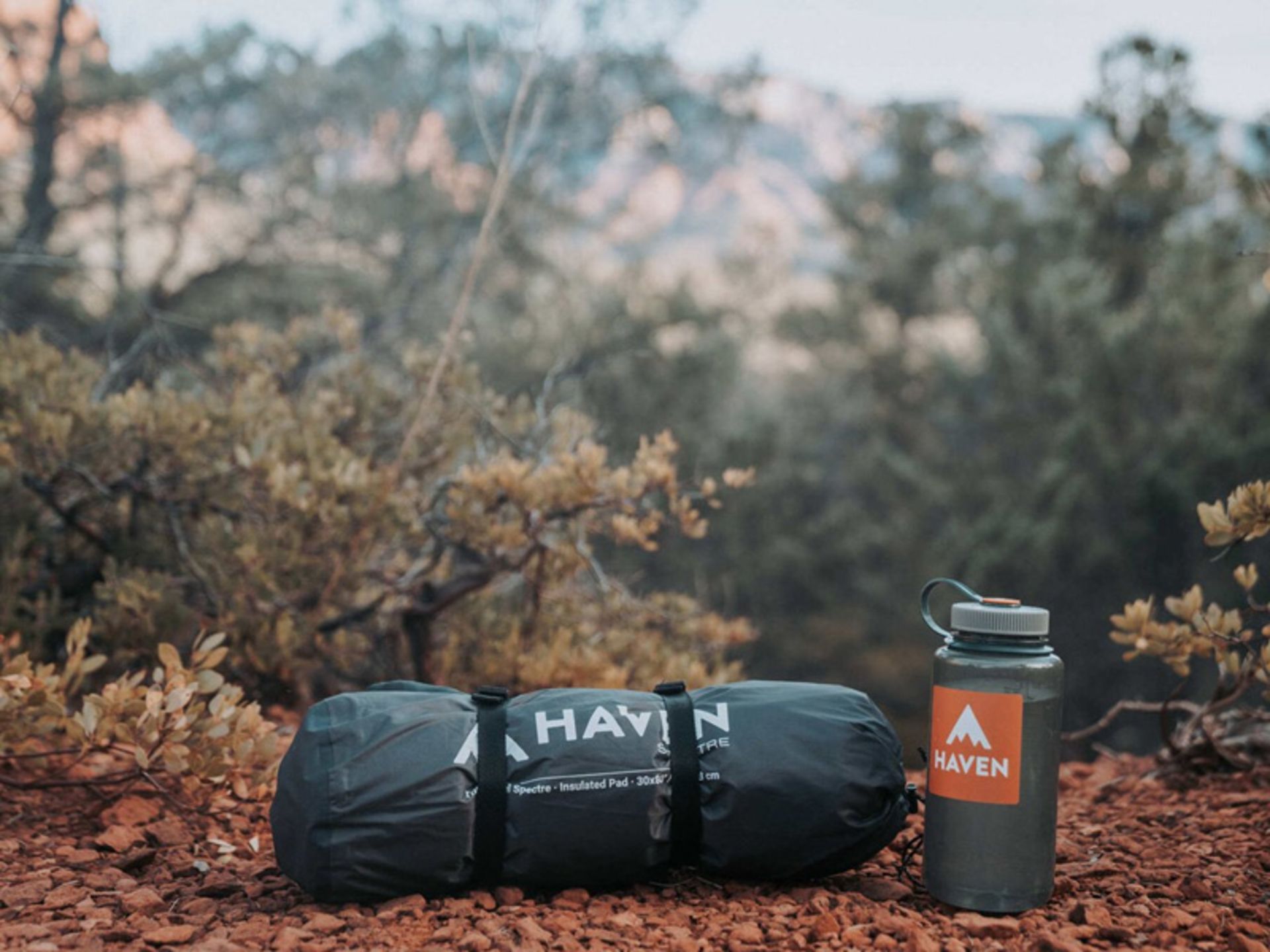 Specter's hanging tent in a folded state next to the flask