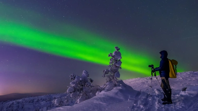 What equipment is needed to travel and watch the aurora borealis?