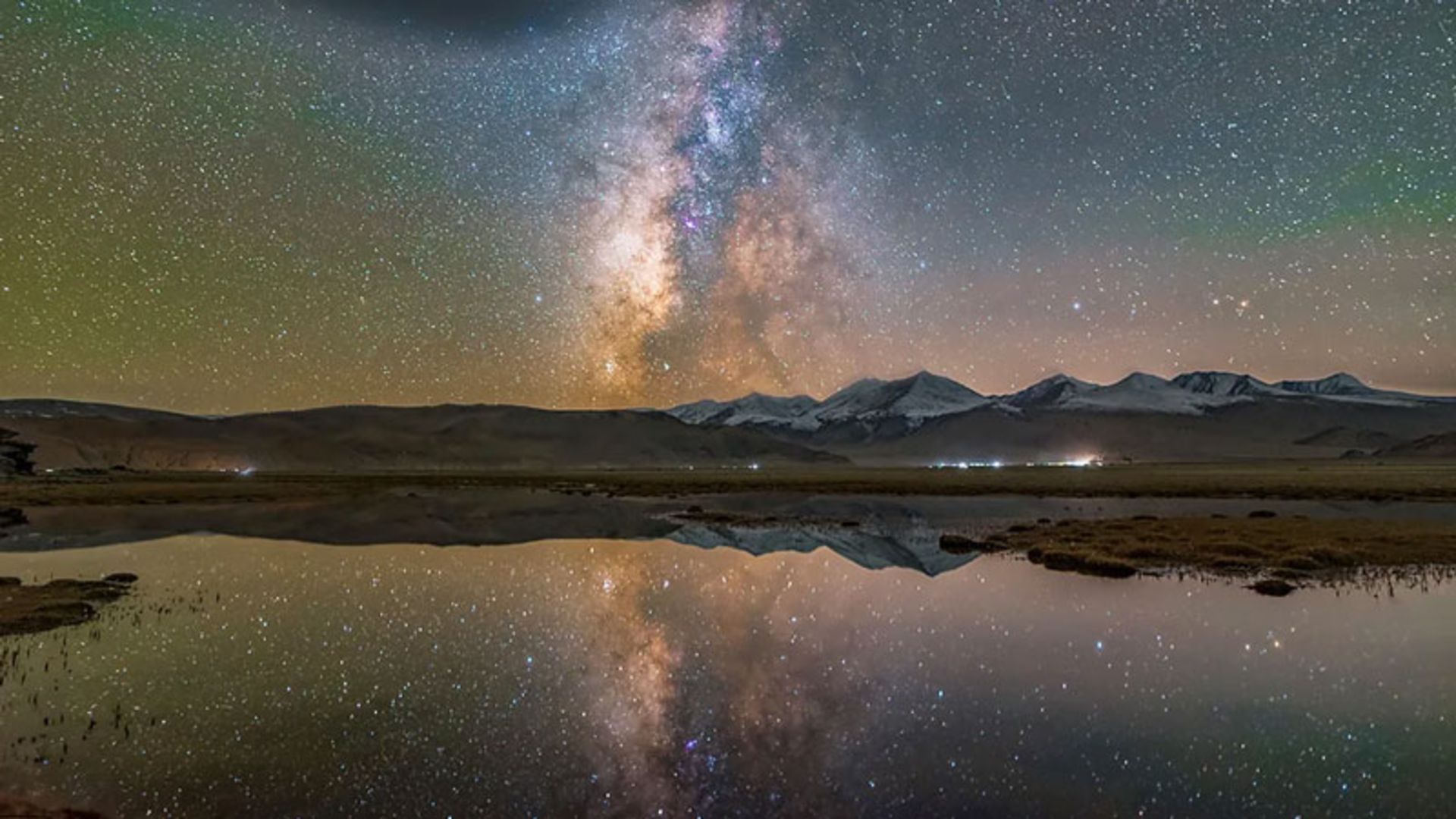 The Milky Way reflected in the calm waters of a small lake in Hanle