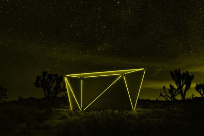 The LED lights of Jupe's folding hut at night