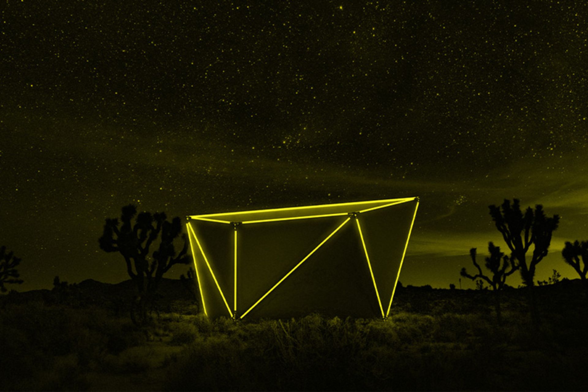 The LED lights of Jupe's folding hut at night