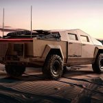 Back view of Keith Sting on Cybertruck in desert environment