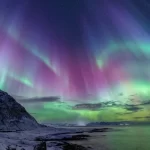 What is aurora borealis and how does it occur?