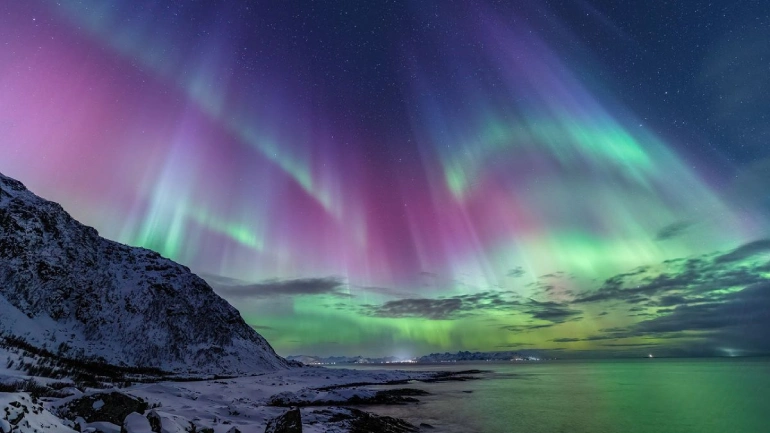 What is aurora borealis and how does it occur?