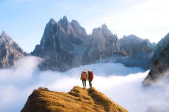 Climbing above the clouds among the Dolomite peaks of Italy