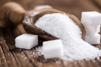 Sugar and sugar on a wooden table