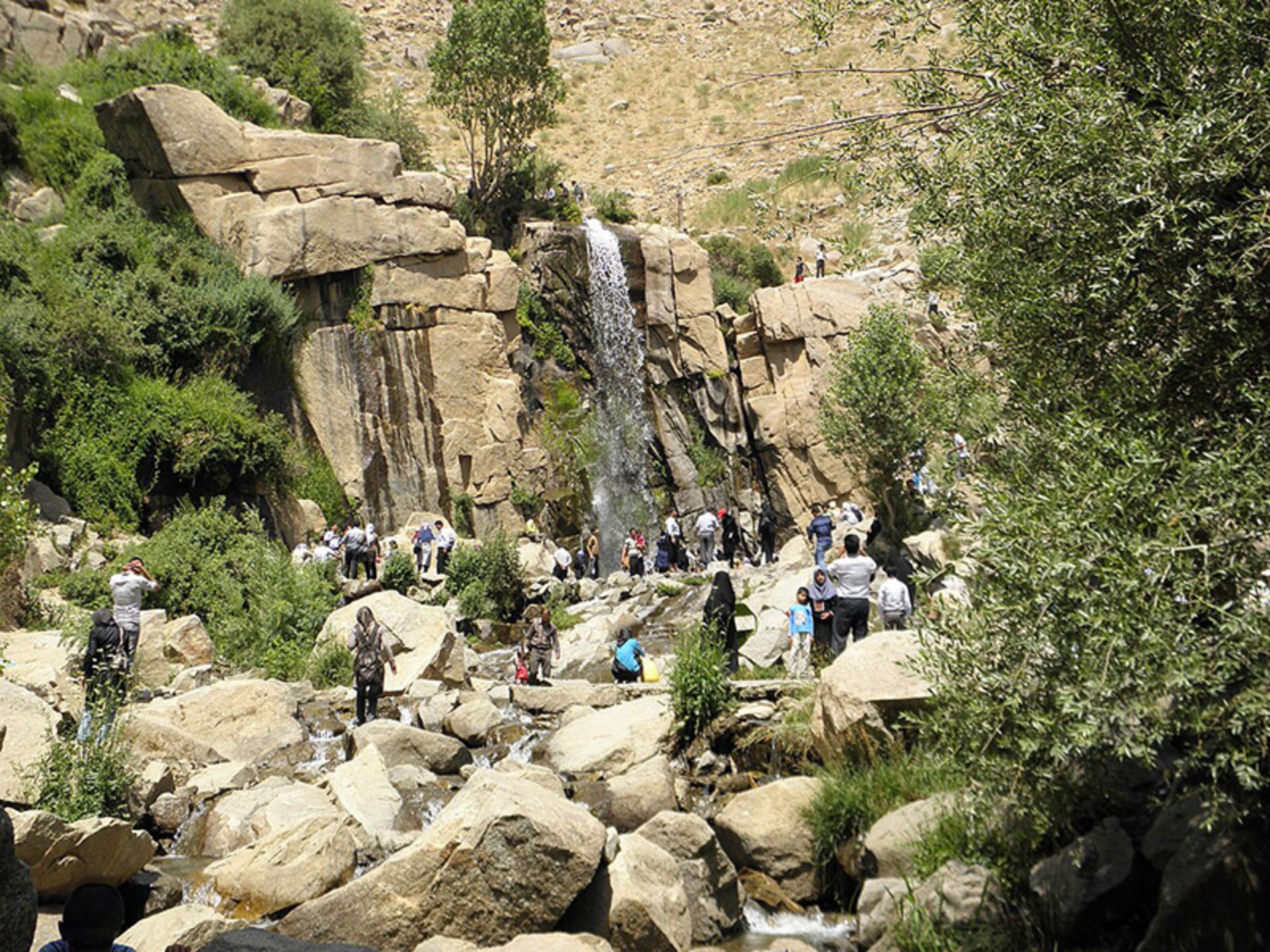 Ganjnameh waterfall in Ganjnameh tourist village of Hamedan