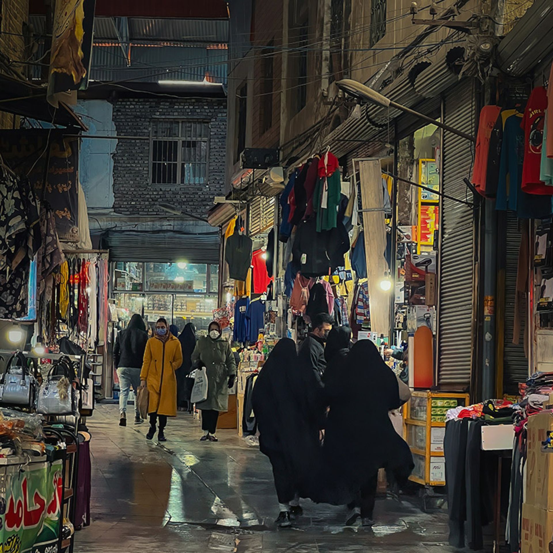 People sightseeing in the traditional market of Hamadan