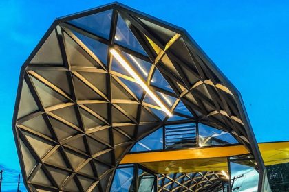 Amazon bus station structure with geometric view and yellow fence