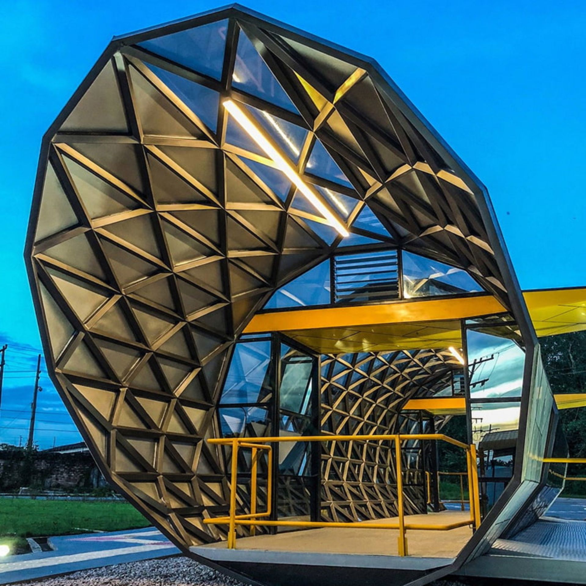 Amazon bus station structure with geometric view and yellow fence