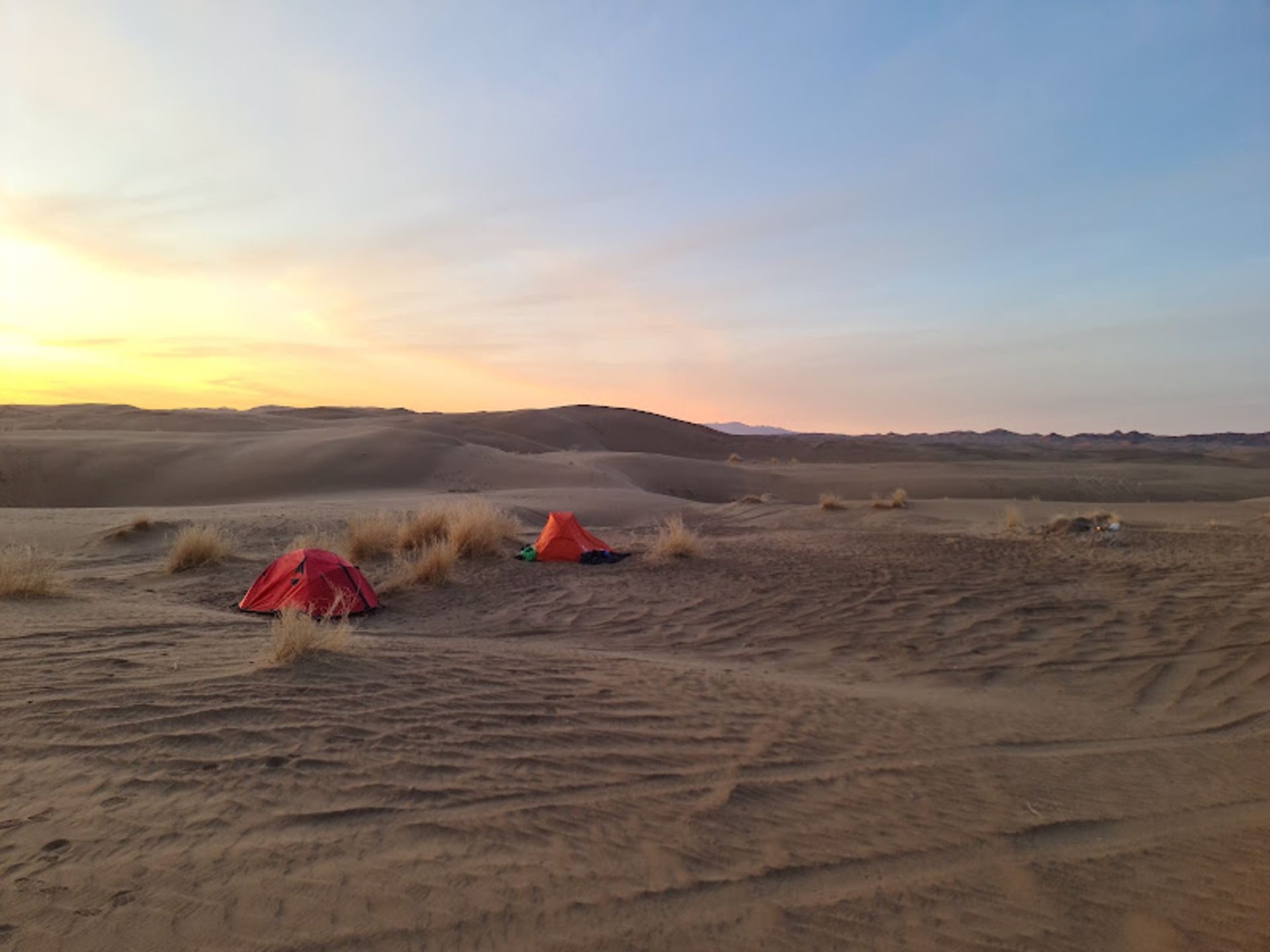Camping and watching the sunset in Maranjab desert