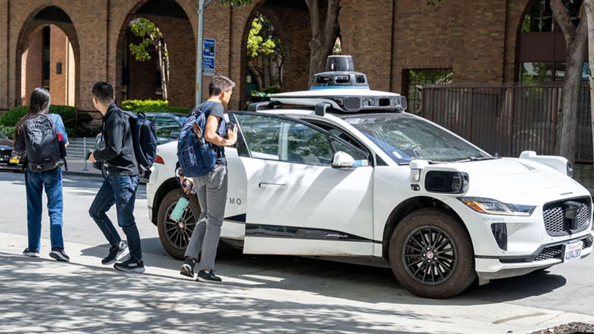 Waymo self-driving car carrying passengers
