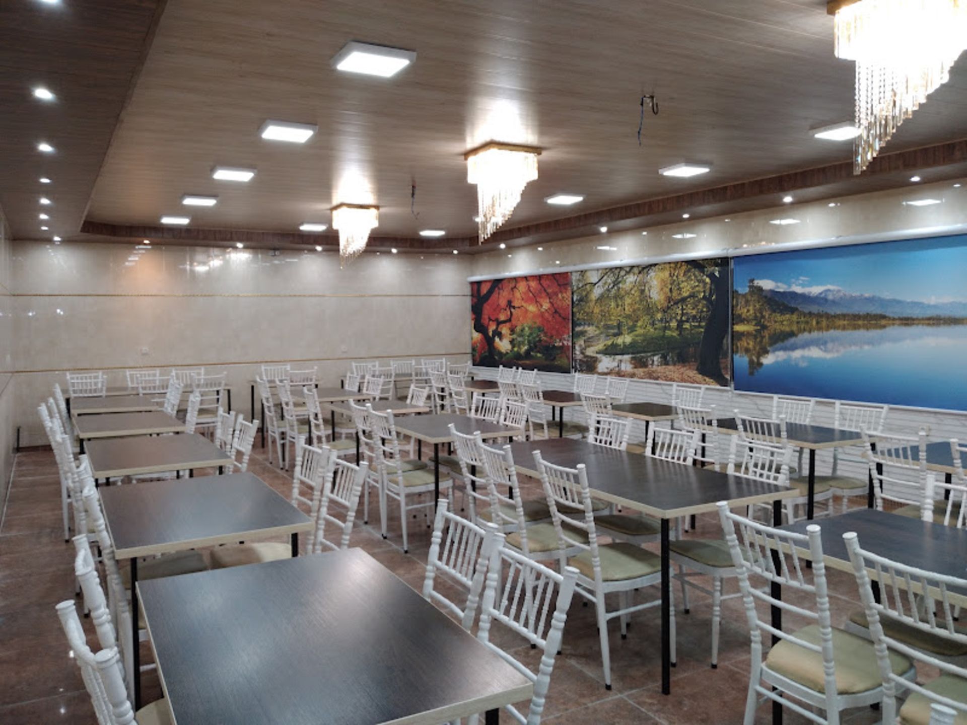 White wooden chairs in Kete Kebab, Talaqani