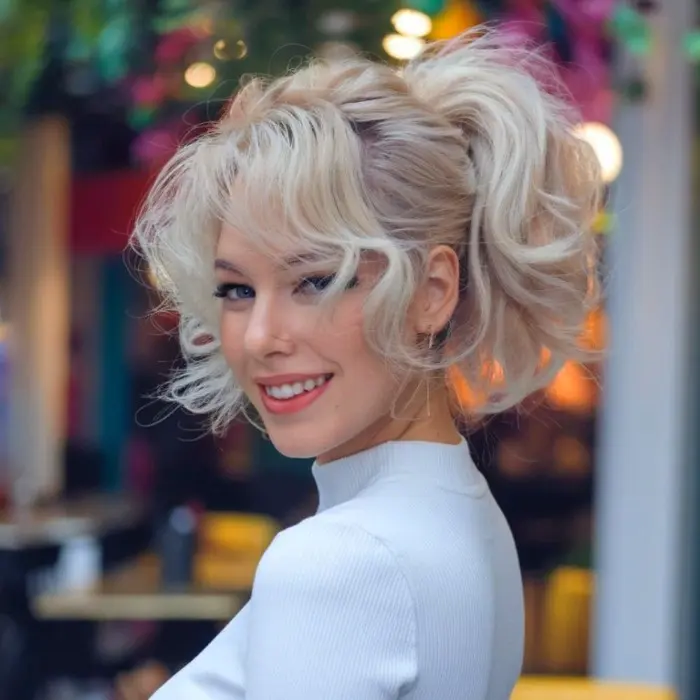 Short curly hairstyle with open ponytail