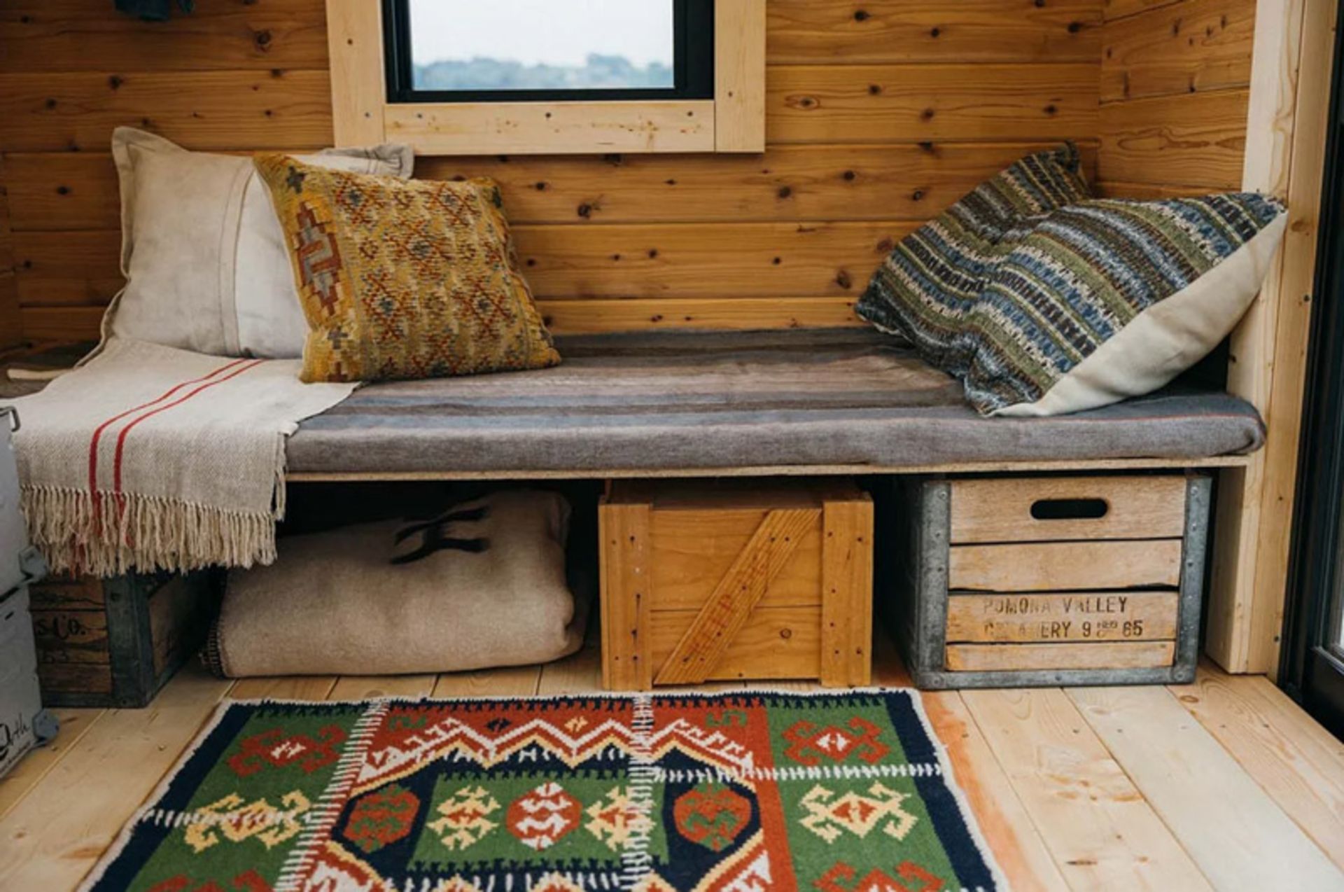 A bed in the interior of the mobile hut