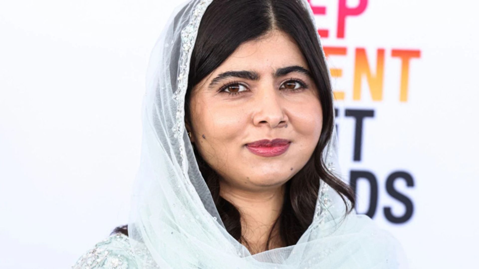 The picture of Malala Yousafzai with a white shawl