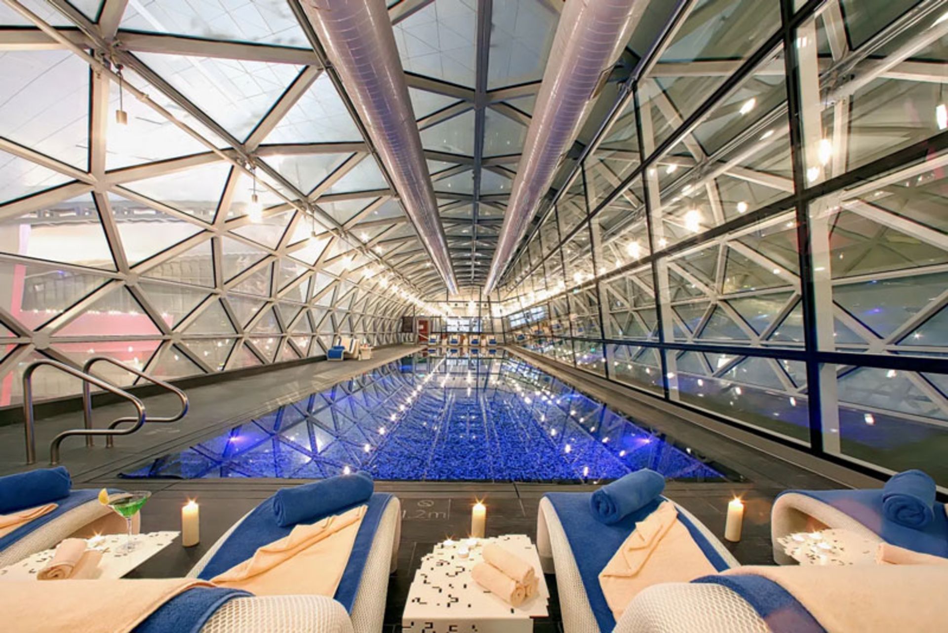 Lighted candles in the spa and pool of the Oryx Hotel in Doha