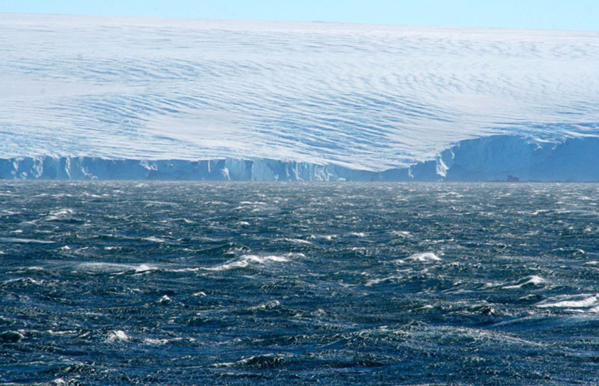 Huge walls of ice against the raging Antarctic Ocean
