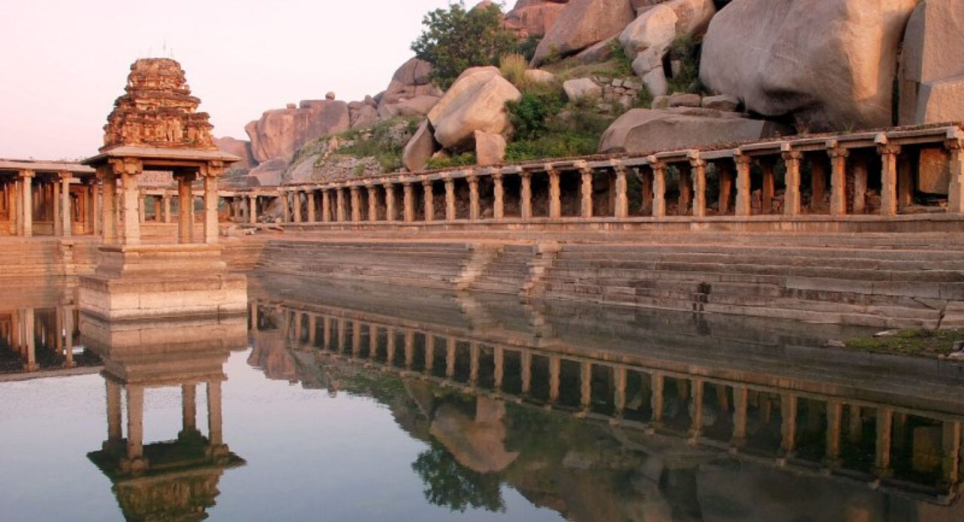 The reflection of the Hampi aqueduct in the water in India