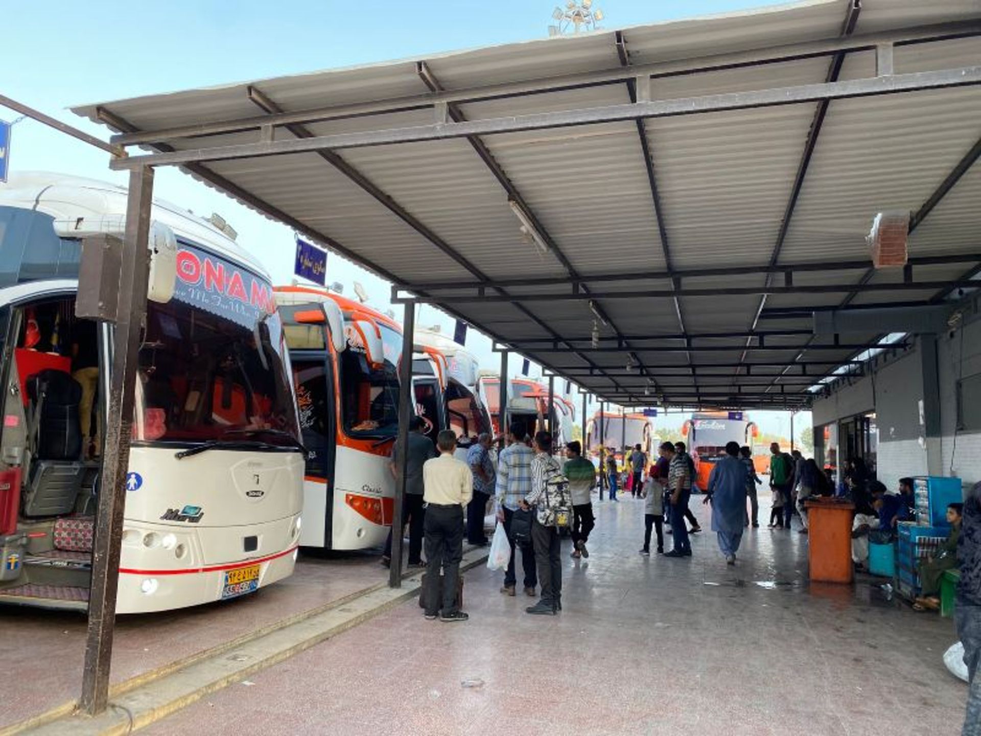Passengers and buses at Bandar Abbas passenger terminal
