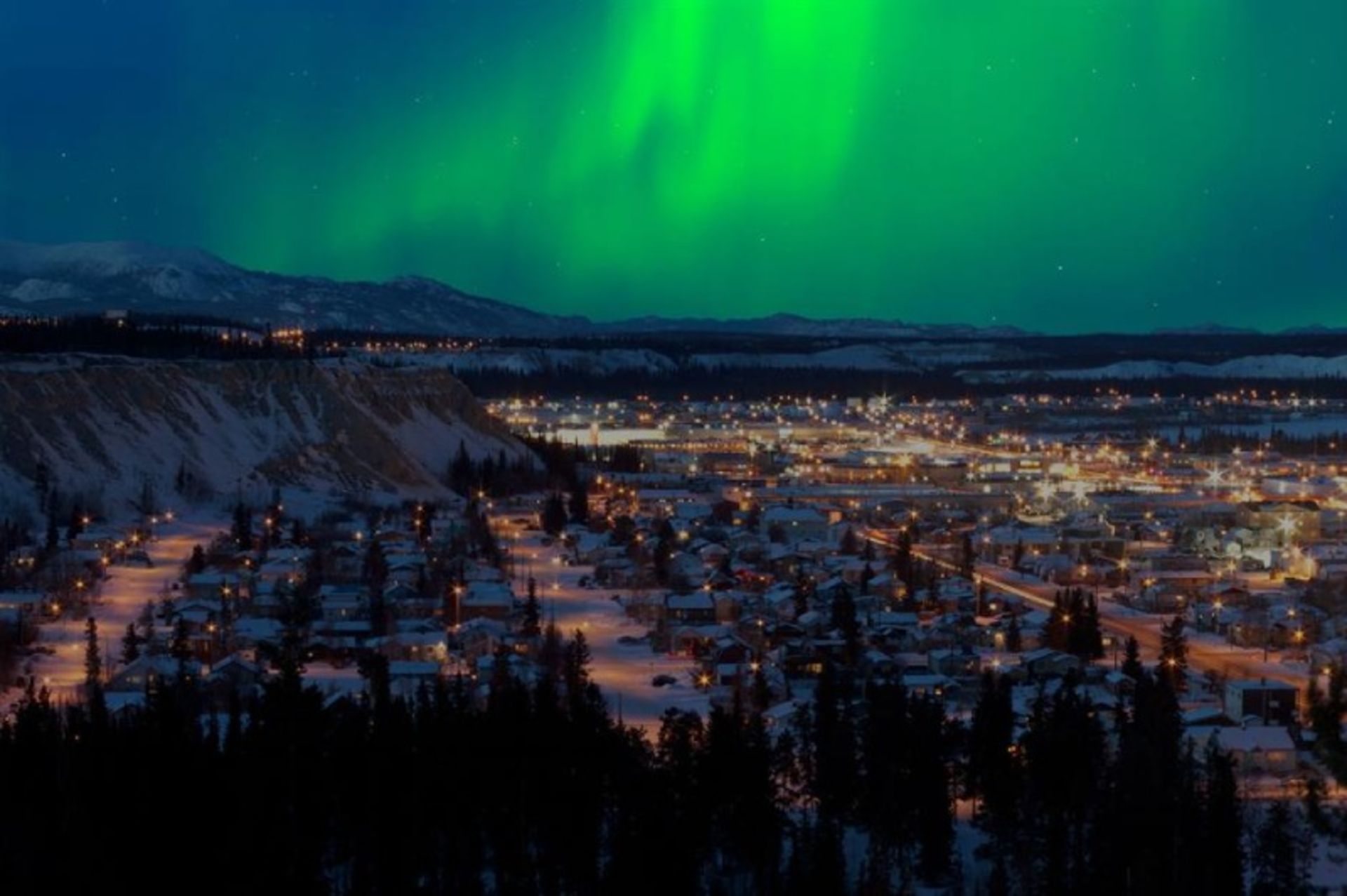 Northern lights in the snowy town of Whitehorse