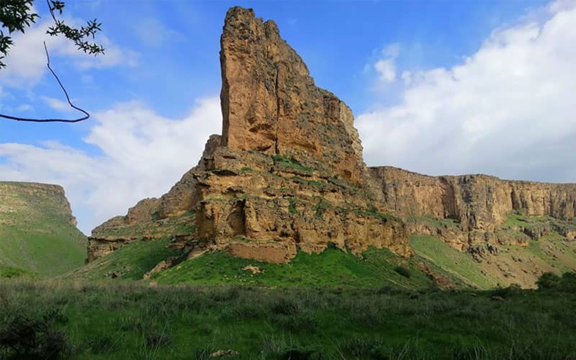 Qamchagai Castle in the middle of a green plain