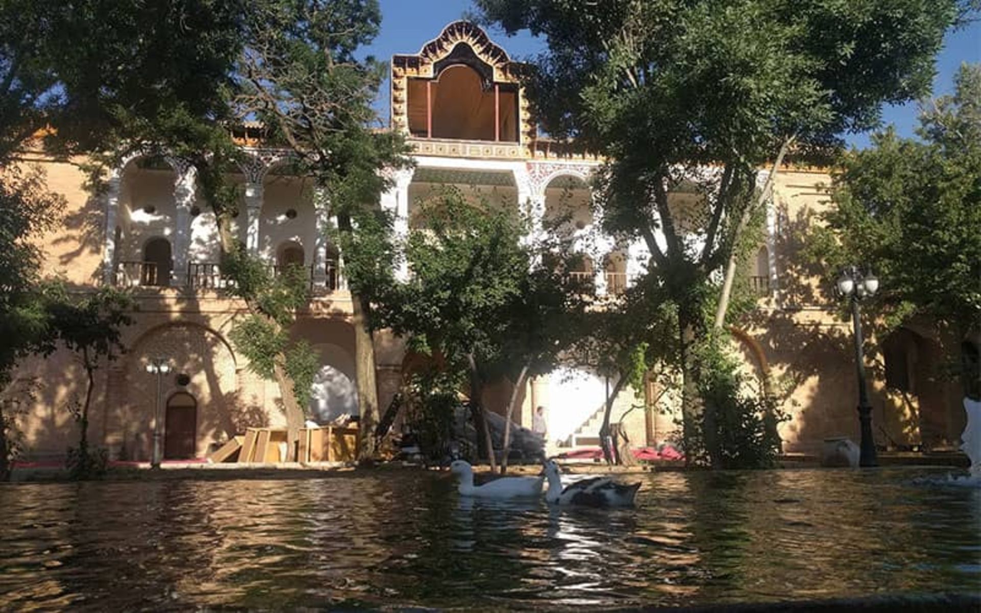 Khosroabad mansion with a water pond in front of it
