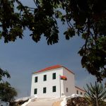 The building of the National Slavery Museum of Angola through the trees