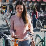 Cyclist woman planning trip with artificial intelligence