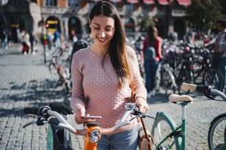 Cyclist woman planning trip with artificial intelligence