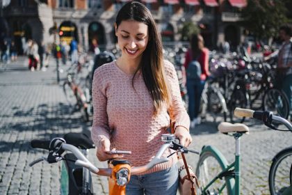 Cyclist woman planning trip with artificial intelligence